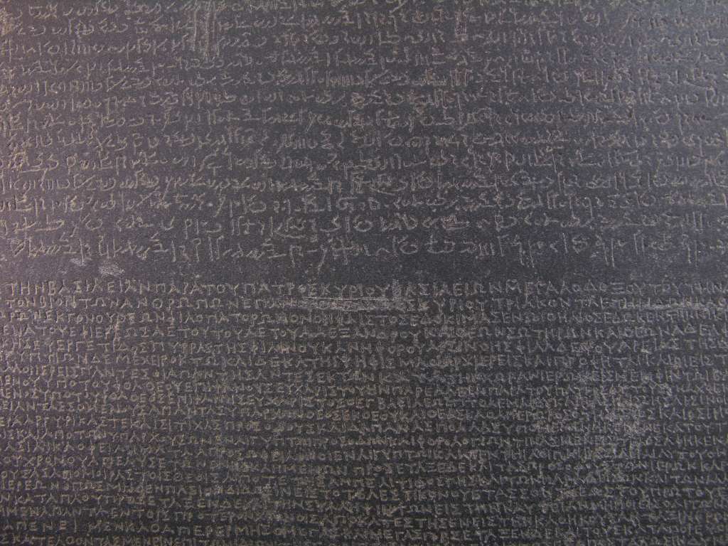British Museum Top 20 01-2 The Rosetta Stone Close Up 1. Rosetta Stone - Rosetta Egypt, 196BC, 114cm high. Here is a close up of the writing in two languages, Egyptian and Greek, using three scripts, Hieroglyphic, Demotic Egyptian and Greek.